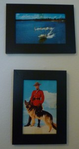 Postcards framed and hung on the wall